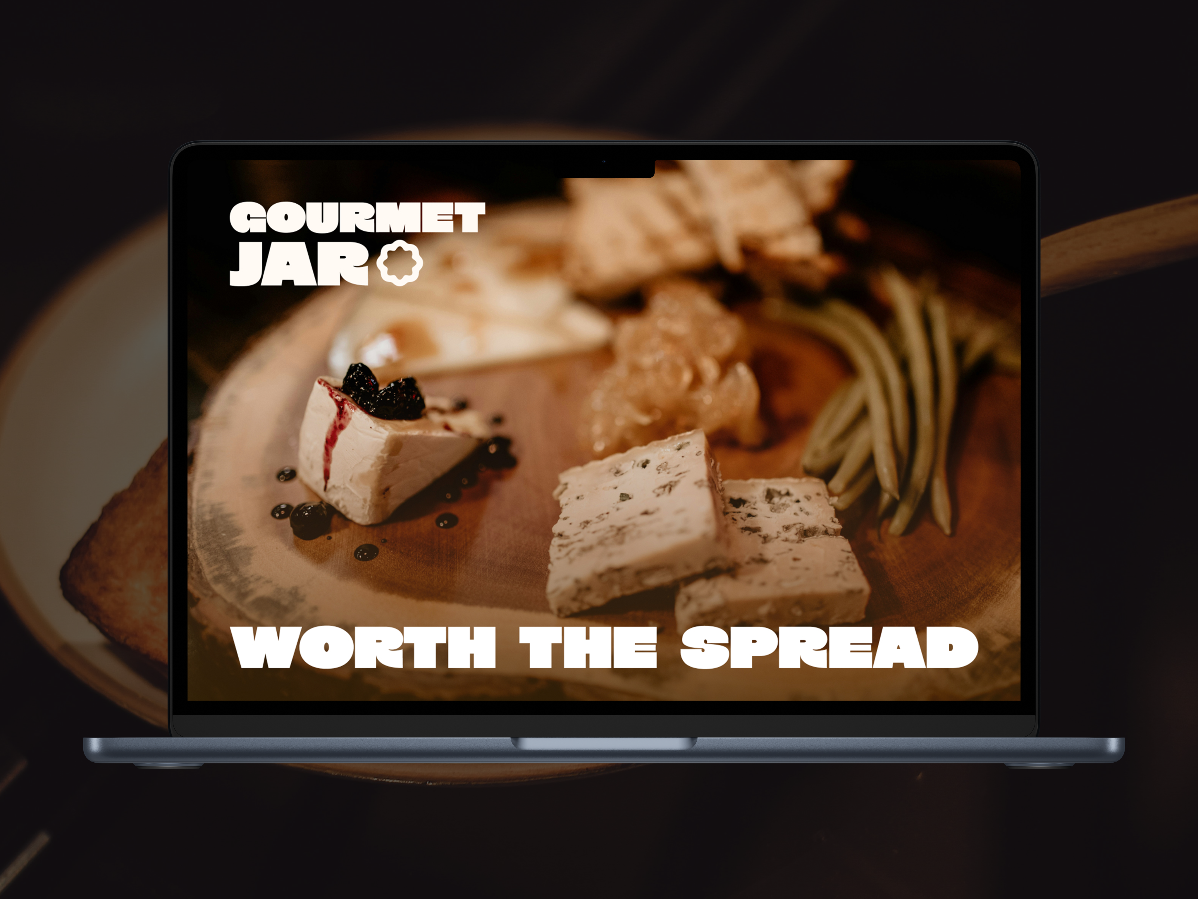 two people sitting on a ledge talking